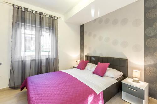 Postel nebo postele na pokoji v ubytování Apartments Karlo