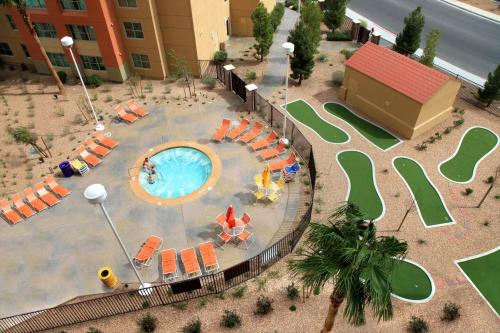 an overhead view of a pool with chairs and tables at The Grandview at Las Vegas in Las Vegas