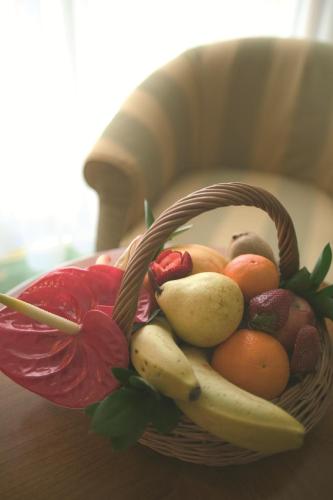 a basket of fruit sitting on a table at Quinta do Monte in Funchal
