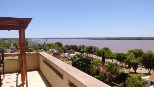 a view of the water from the balcony of a building at 11 Peyret Rent Aparts in Colón