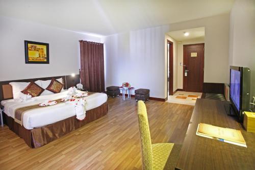 Una cama o camas en una habitación de Park View Hotel