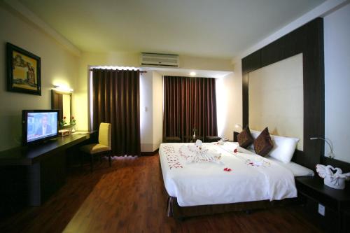 Una cama o camas en una habitación de Park View Hotel