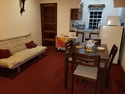 a living room with a table and a couch at Beya Suites in Punta Gorda