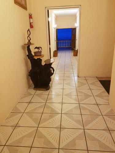 a hallway with a tiled floor in a room at Beya Suites in Punta Gorda