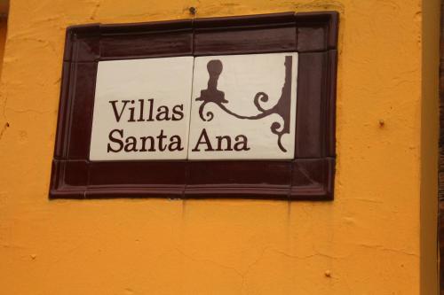a sign on a wall that reads villas santa ana at Villas Santa Ana-Ricardo in Antigua Guatemala