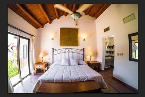 Postel nebo postele na pokoji v ubytování Villa Ikal