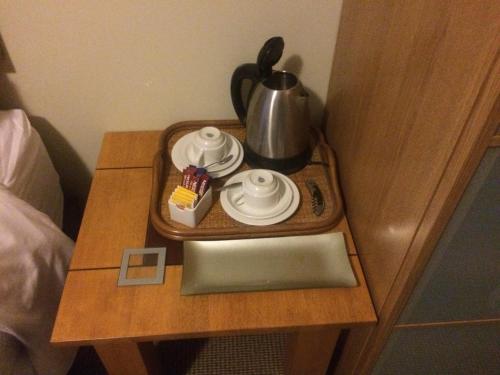 a wooden table topped with a tray filled with food at Breakwater Short Stay in Mandurah