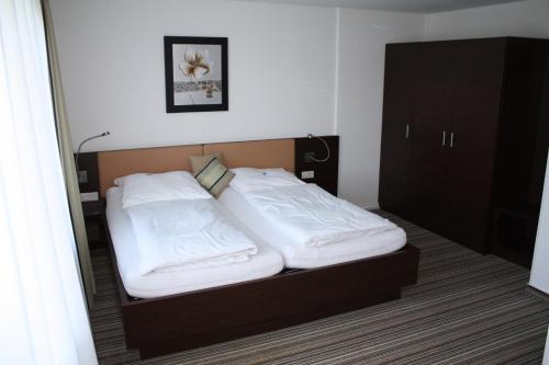 Ein Bett oder Betten in einem Zimmer der Unterkunft Gasthof Hoppe