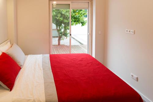 
A bed or beds in a room at Apartamento Ideal 3
