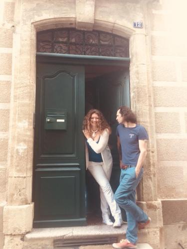 two women standing in the doorway of a building at Chez les artistes in Servian