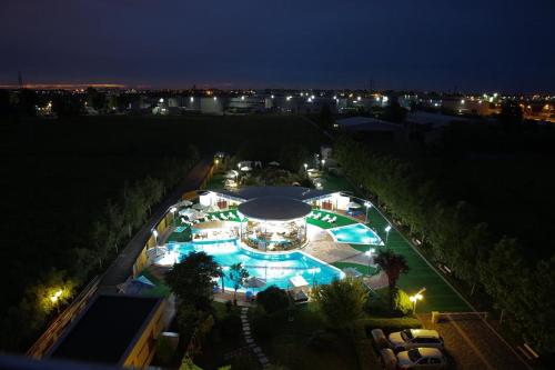 an overhead view of a large pool at night at Mari Vila Hotel in Bucharest