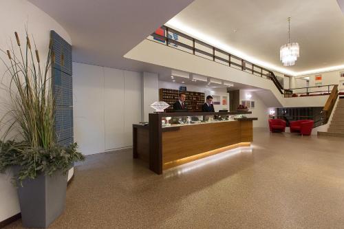 a lobby of a law firm with a reception desk at Hotel Italia in Cagliari