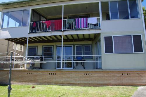 an apartment building with clothes hanging on the balcony at Apollo 2 9 Hodgson Street in Crescent Head
