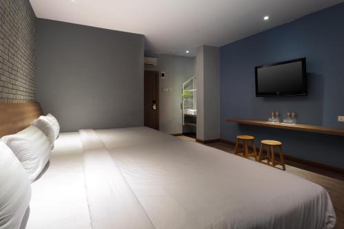 Una cama o camas en una habitación de Kama Hotel