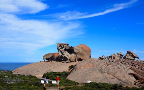 a group of people standing on top of a rock formation at Mercure Kangaroo Island Lodge in American River