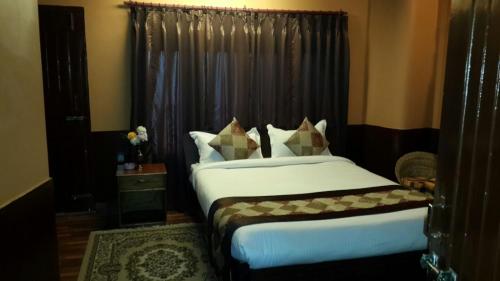 Llit o llits en una habitació de Hotel Payal