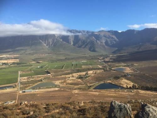 an aerial view of a valley with a mountain at Kuruma Farm Cottages in Worcester