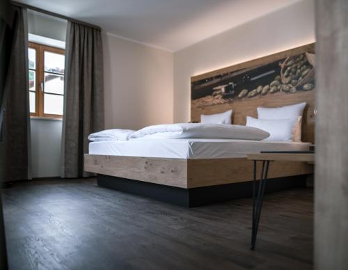 เตียงในห้องที่ Bierhotel - Hotel & Brauereigasthof Schneider