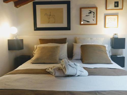 a bedroom with a large bed with two pillows at Stella21 BedandBreakfast in Modena