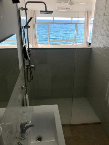 a bathroom with a shower and a sink at Hotel Boutique Milla de Plata in Torreguadiaro