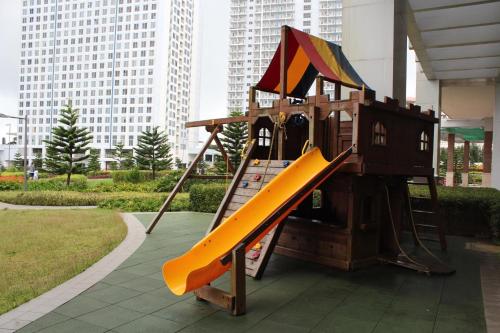 a playground with a slide in a park at La Cassandra at SMDC Wind Residences Tower 2 - Tagaytay City in Tagaytay