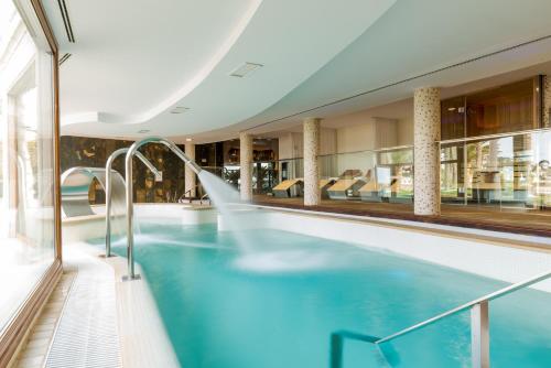 an indoor swimming pool in a building with a building at Nixe Palace in Palma de Mallorca