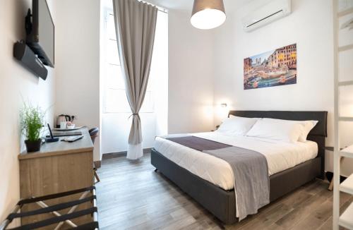 A bed or beds in a room at Clementi 18 Suites Rome
