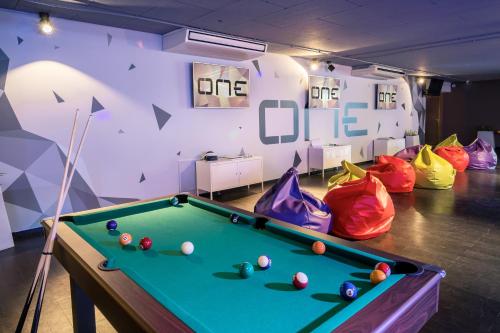 a room with a pool table and some bags at Barceló Cabo de Gata in Retamar