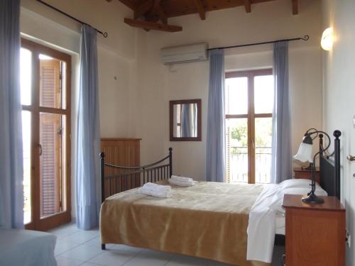 Postel nebo postele na pokoji v ubytování Anastasia Apartments