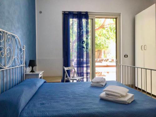 Кровать или кровати в номере B&B Eraclea Minoa Mare
