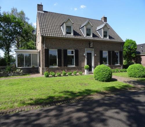 a large white house with a large window at Brinkesdiek in Hardenberg