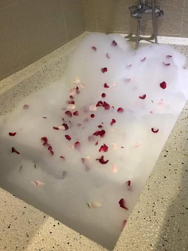 a white counter top with red hearts on it at Touch 星空包棟民宿寵物友善民宿 in Wujie