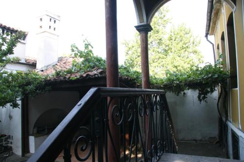 a staircase leading to a building with a clock tower at Guest House Old Plovdiv in Plovdiv