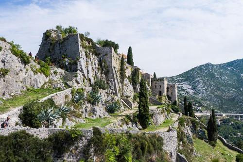 a castle on the side of a mountain at Serena Apartment in Podstrana