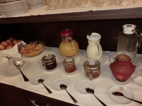 a table with spoons and other food items on it at Varandas de Alter Hotel & SPA in Alter do Chão