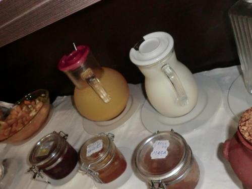 a group of glass jars and jars of honey at Varandas de Alter Hotel & SPA in Alter do Chão