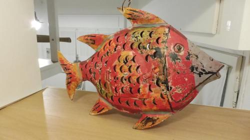 a statue of a fish on top of a table at Sa Caletta Appartamenti in Portoscuso