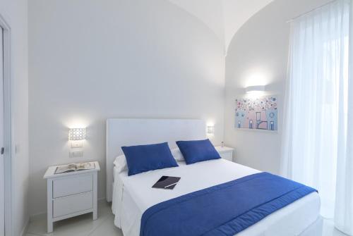 מיטה או מיטות בחדר ב-Exclusive Home Ischia