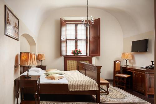 Кровать или кровати в номере Hotel Monastyrski Minsk City Centre