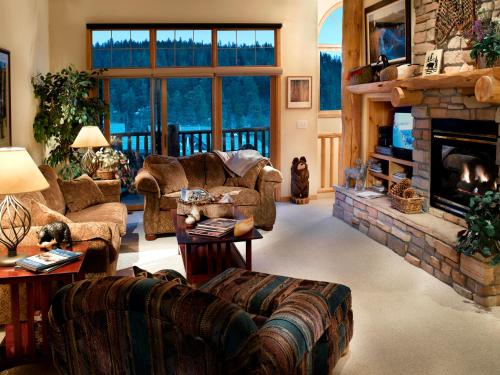a living room with a couch and a fireplace at The Forest Neighborhood by Keystone Resort in Keystone