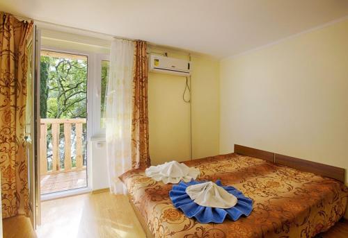 Posteľ alebo postele v izbe v ubytovaní Pansionat Solnechniy