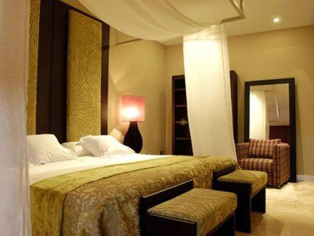 Gulta vai gultas numurā naktsmītnē Hotel Bodega Pago del Vicario