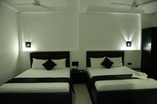 Postel nebo postele na pokoji v ubytování Villa Hotel
