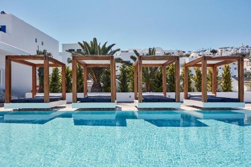 a pool at a hotel with blue water at Callia Retreat Suites - Adults Only in Fira