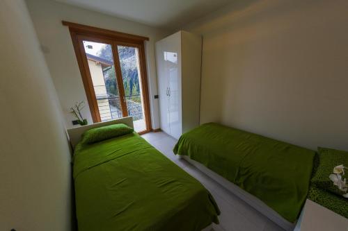 Katil atau katil-katil dalam bilik di Residence degli Oleandri 4B