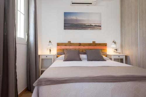 a bedroom with a large bed with two night stands at Finca Buenavista in Chilches