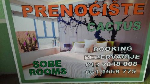 a sign for a bedroom with a bed in a room at Kaktus in Kaluđerovo