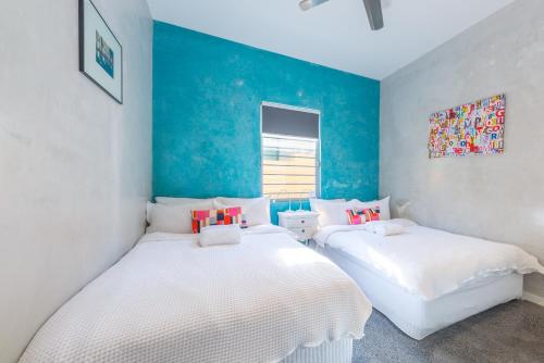 Cama ou camas em um quarto em Chic East Sydney Pad