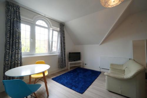 A seating area at One Helena Road Serviced Apartments 