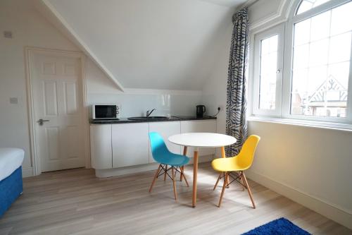 A kitchen or kitchenette at One Helena Road Serviced Apartments 